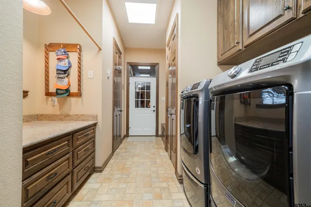 a hallway with washer and dryer