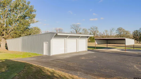 a backyard of a house with garage