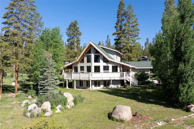 a house with trees in the background