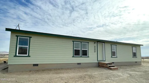 a kitchen with stainless steel appliances kitchen island granite countertop a refrigerator stove top oven and sink