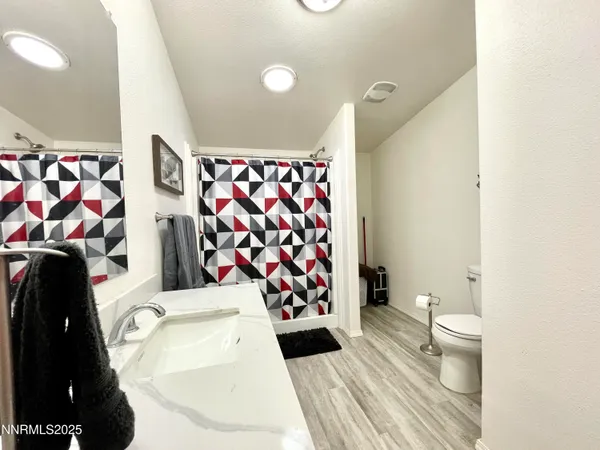 a living room with a sink and a toilet