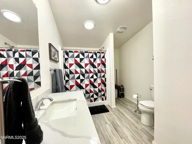 a living room with a sink and a toilet