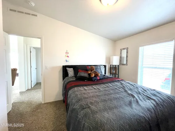 a bathroom with a toilet and a shower curtain