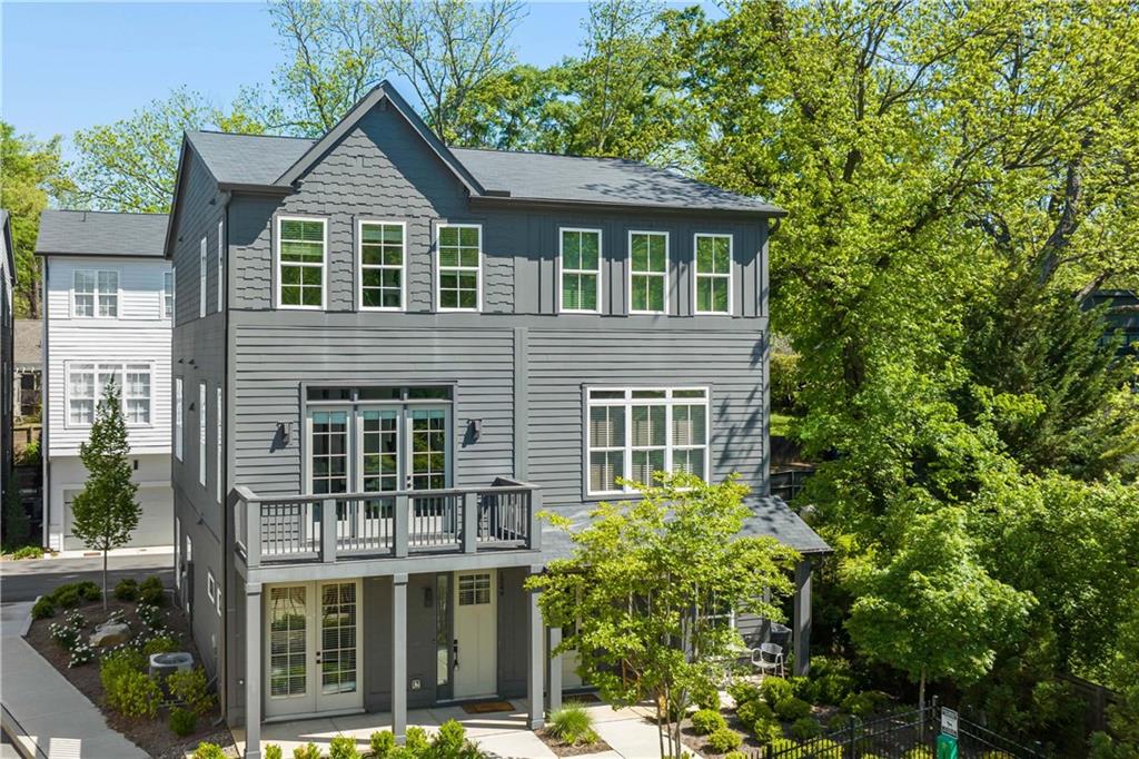 1249 Oxley Lane Northwest Atlanta, GA 30307 - Photo 1 of 1 a view of a house with a window and plants