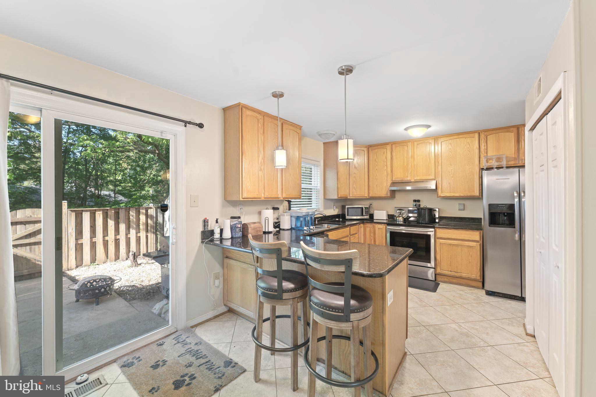 8054 Powderbrook Lane Springfield, VA 22153 - Photo 11 of 29 Kitchen exits to patio.
