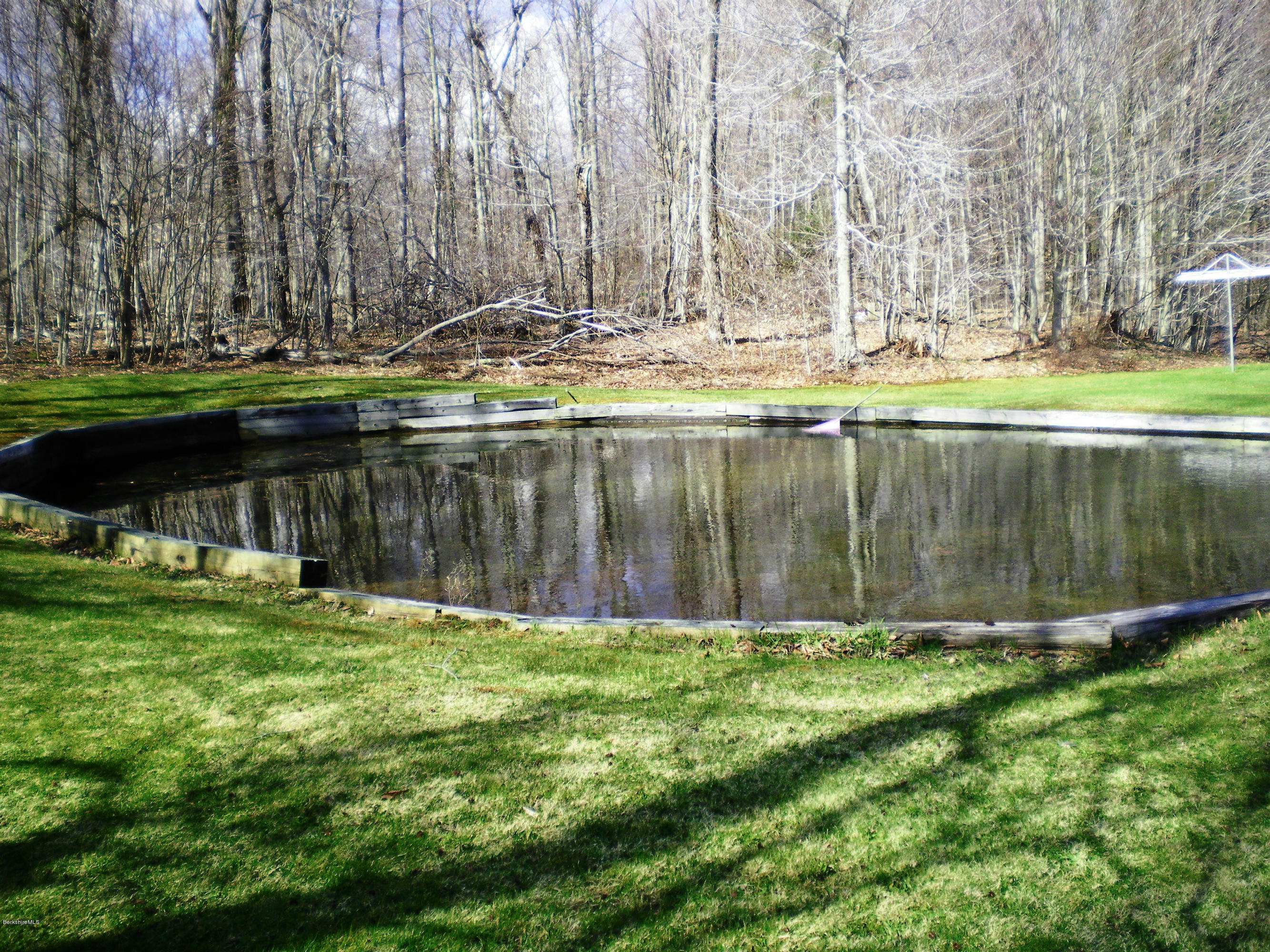 104 Middlefield Road Peru, MA 01235 - Photo 11 of 29 a view of a lake with a large trees