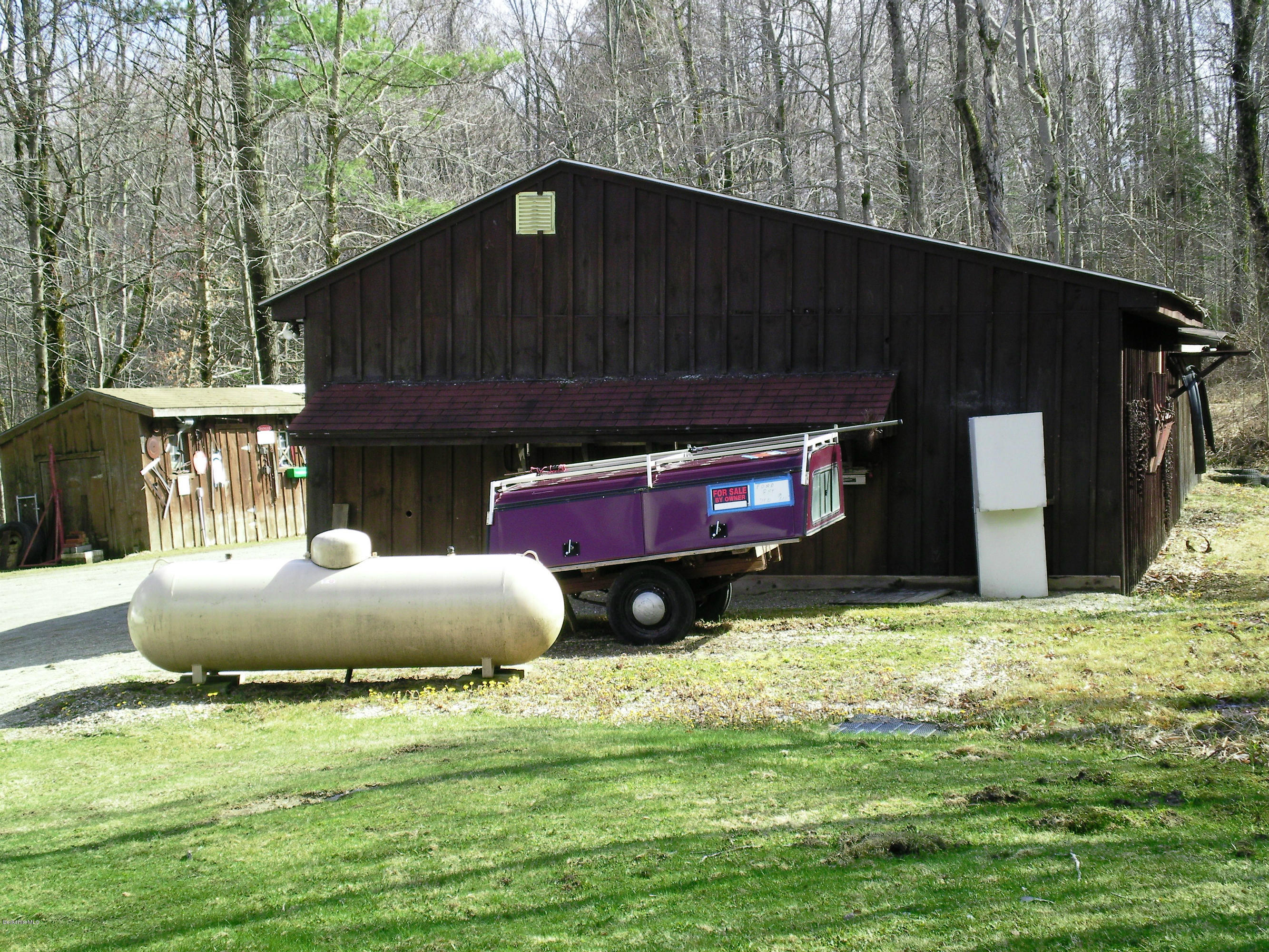104 Middlefield Road Peru, MA 01235 - Photo 16 of 29 a backyard of a house with oven and yard