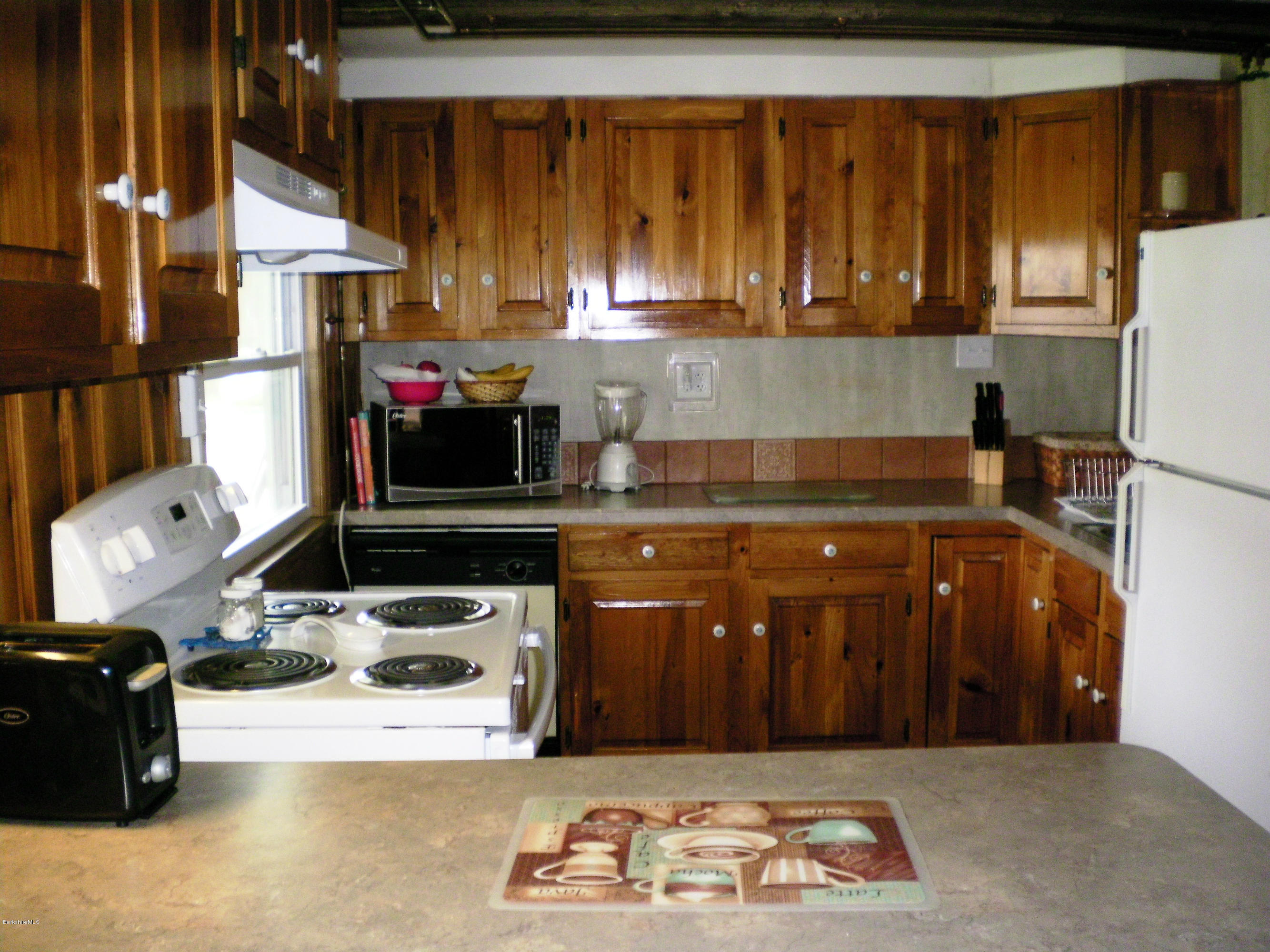 104 Middlefield Road Peru, MA 01235 - Photo 17 of 29 a kitchen with a cabinets and window