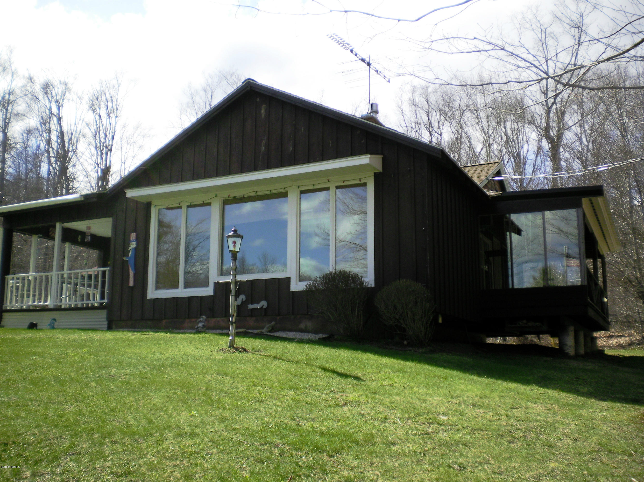 104 Middlefield Road Peru, MA 01235 - Photo 3 of 29 a front view of a house with garden