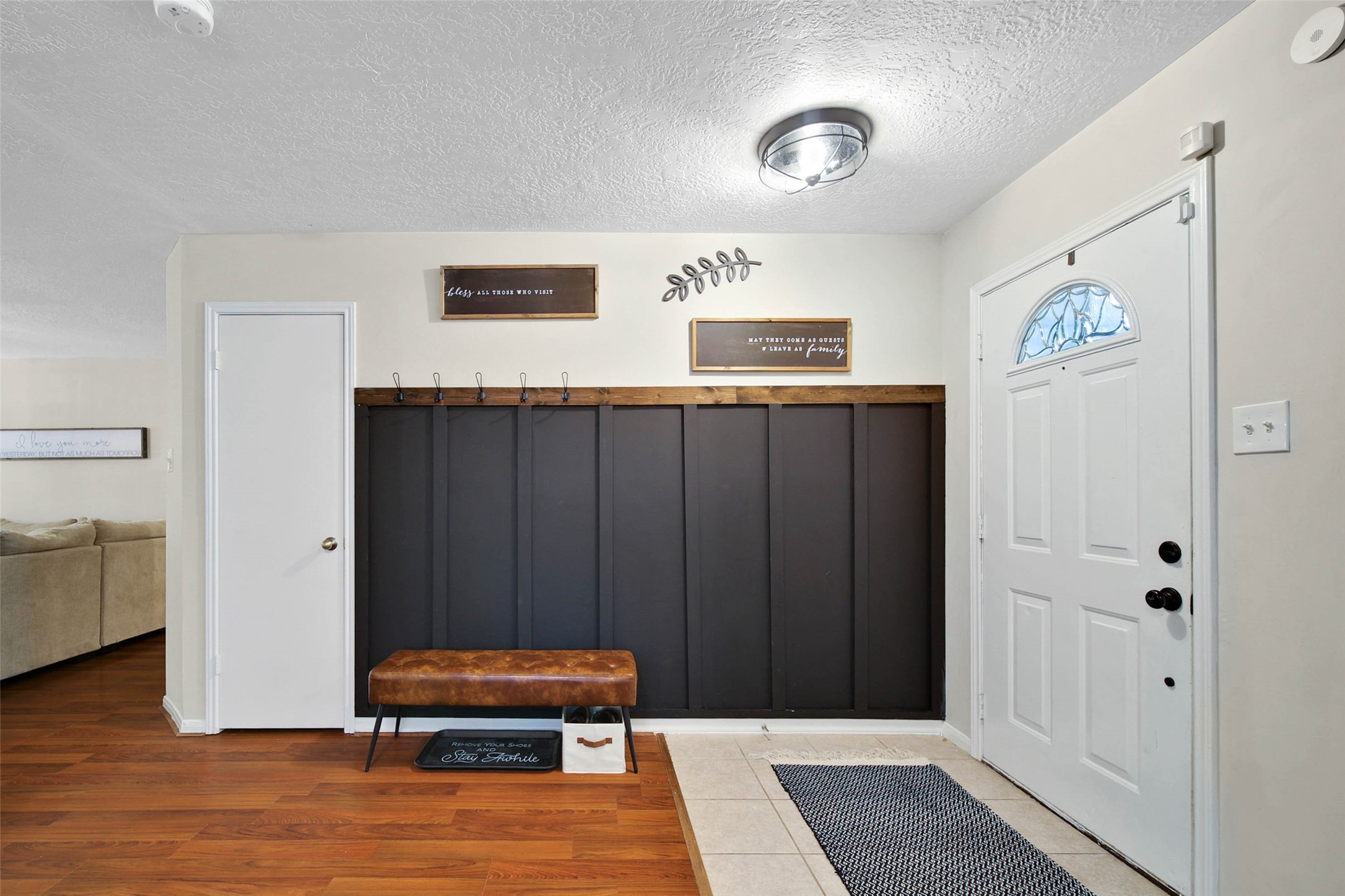 4843 Drew Forest Lane Humble, TX 77346 - Photo 2 of 21 Custom made, this little mud area is right off of the front door area and an ideal spot for backpacks and shoes making them easy to grab on your way in and out the door.