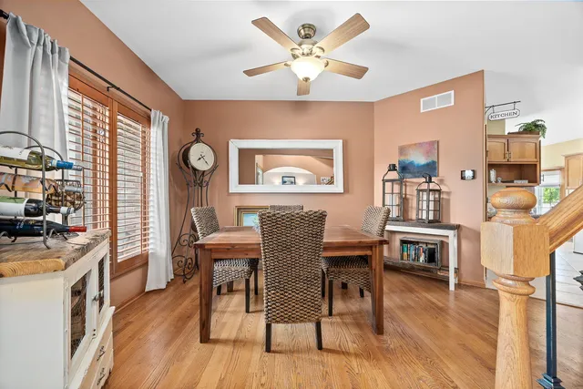 a view of a dining room with furniture window and wooden floor