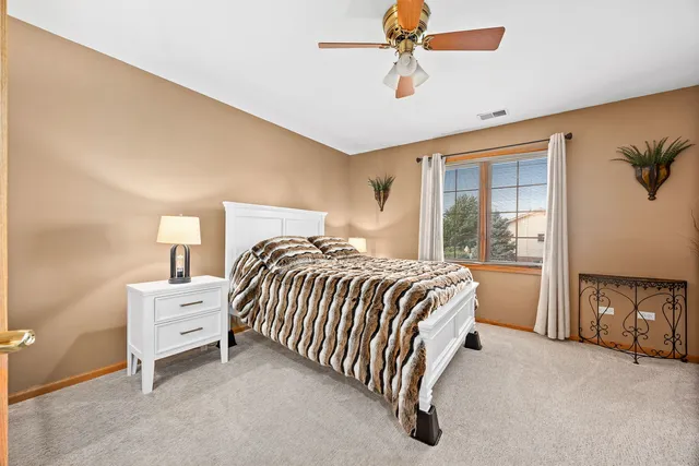 a bed room with a bed and a chandelier