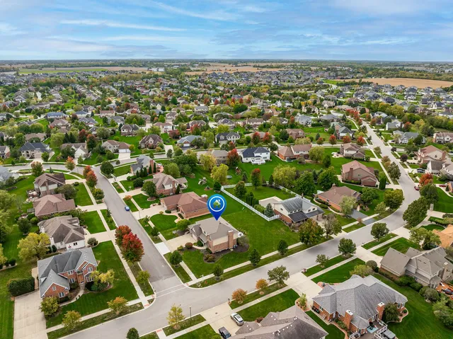 an aerial view of residential houses with outdoor space