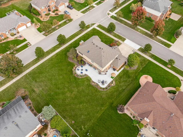 an aerial view of a house with a garden