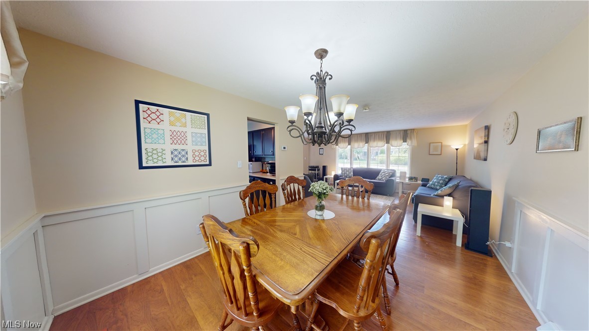 1071 Roland Road Lyndhurst, OH 44124 - Photo 6 of 30 Dining room featuring a chandelier and light hardwood floors