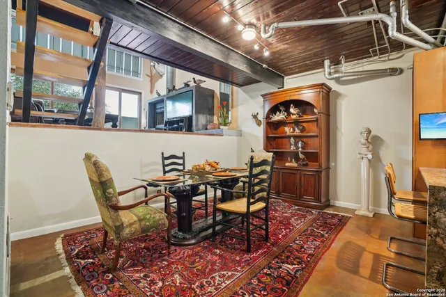 a view of a dining room with furniture