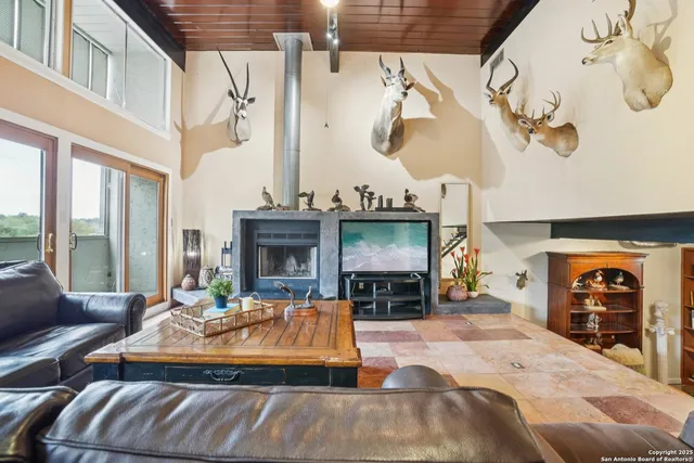 a view of a livingroom with furniture and a fireplace