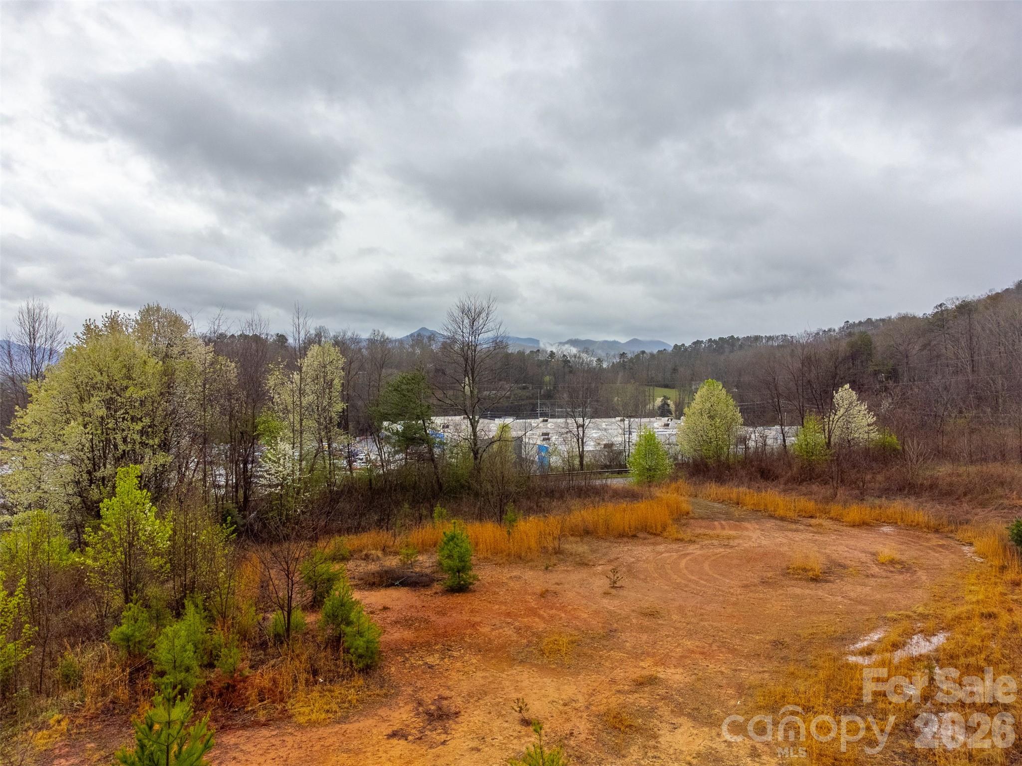0 Connor Road Sylva, NC 28779 - Photo 11 of 22 a view of a lake with houses in the back