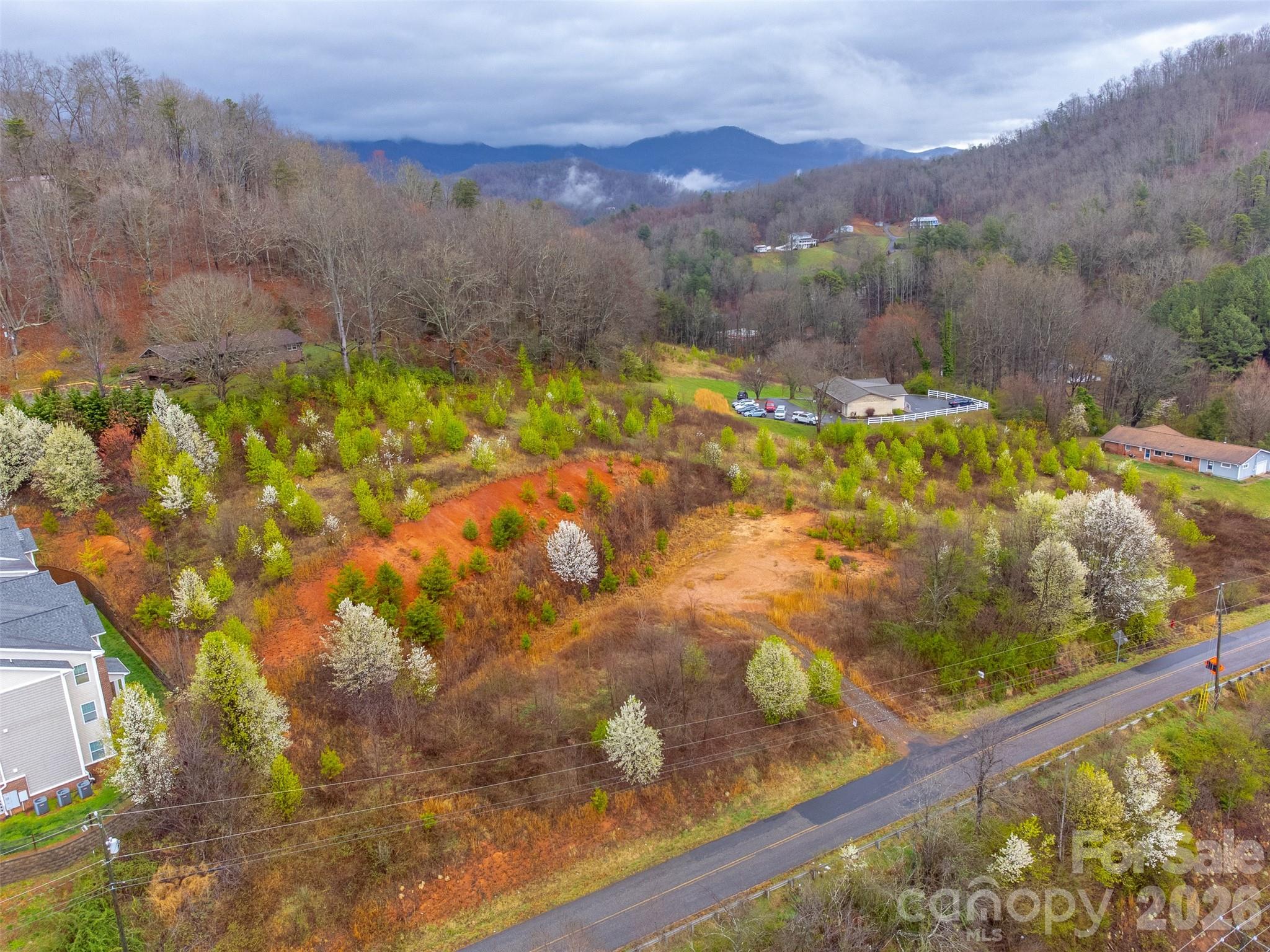 0 Connor Road Sylva, NC 28779 - Photo 19 of 22 a view of a lake with a mountain in the background