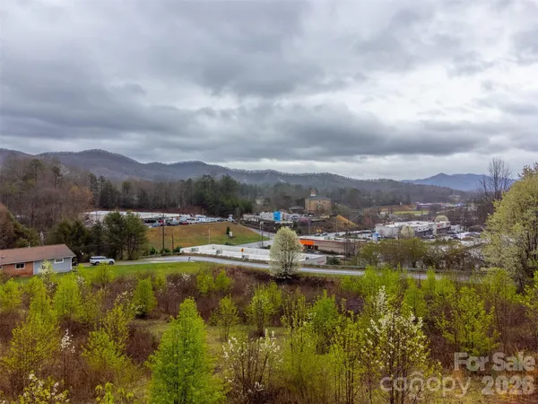 a view of a lake with houses in the back