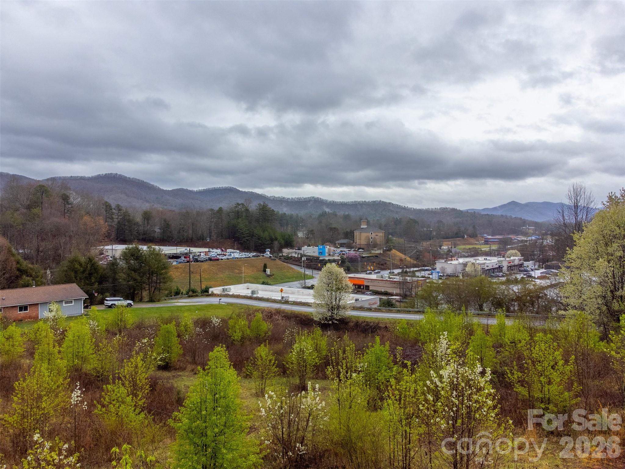 0 Connor Road Sylva, NC 28779 - Photo 10 of 22 a view of a lake with houses in the back
