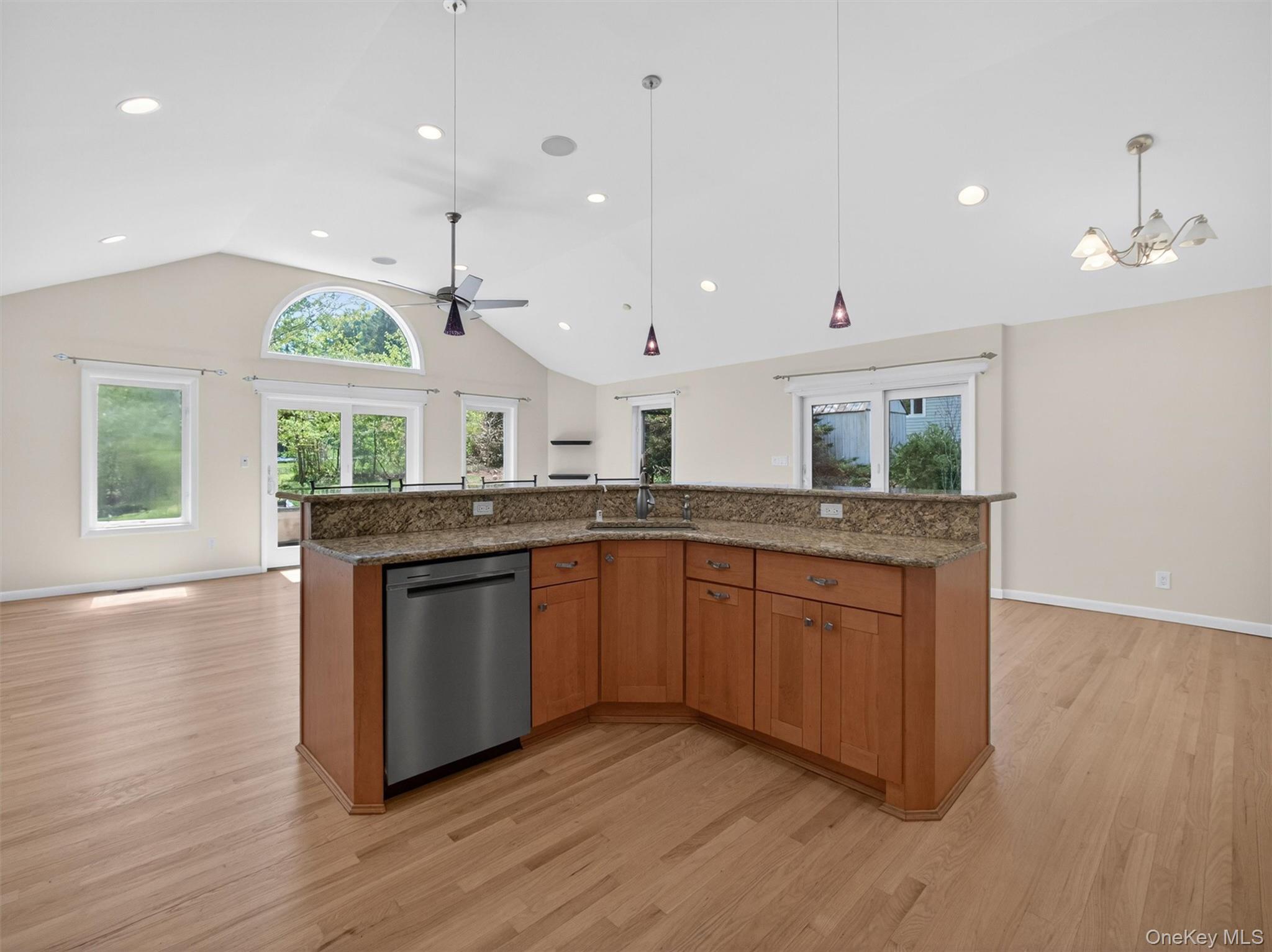 19 Buckingham Road Nanuet, NY 10954 - Photo 11 of 39 Open sightlines from the kitchen into the great room, showcasing the airy layout and seamless flow between living spaces.