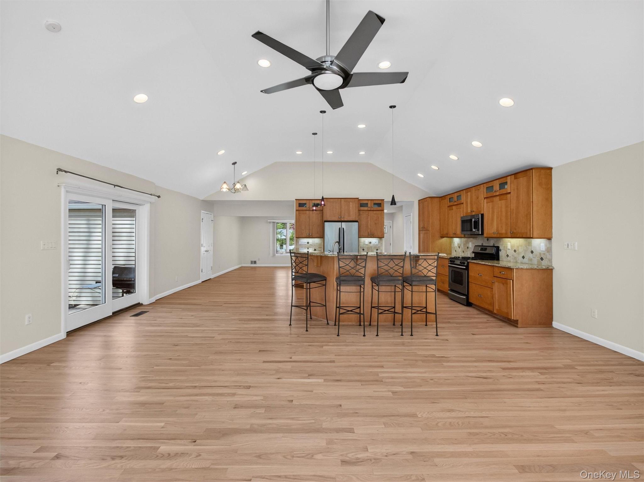 19 Buckingham Road Nanuet, NY 10954 - Photo 12 of 39 Open-concept layout highlighting the kitchen, dining area, and family room together.