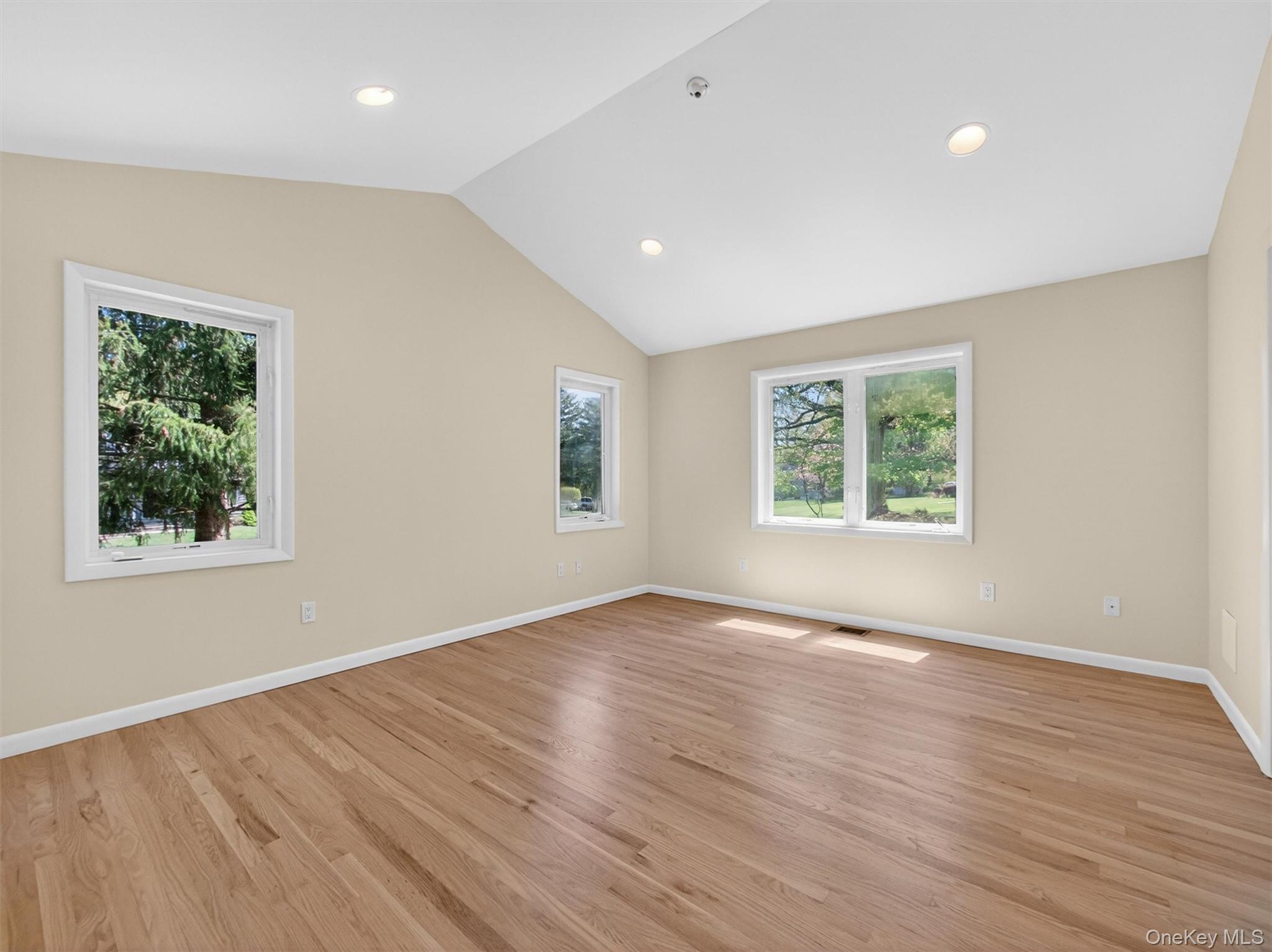 19 Buckingham Road Nanuet, NY 10954 - Photo 16 of 39 Spacious retreat featuring vaulted ceilings, hardwood floors, and abundant natural light.