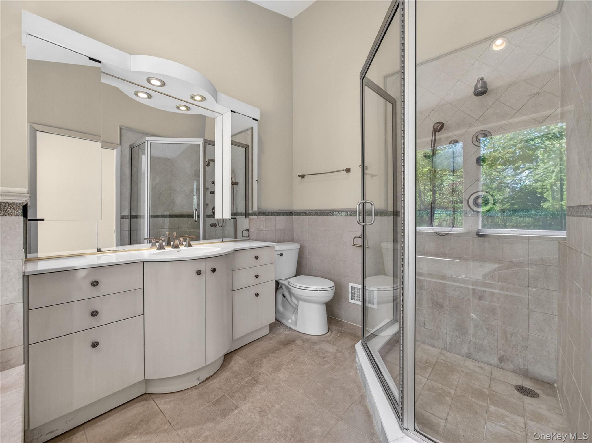 19 Buckingham Road Nanuet, NY 10954 - Photo 19 of 39 Double sink vanity and walk-in shower offering both comfort and functionality.