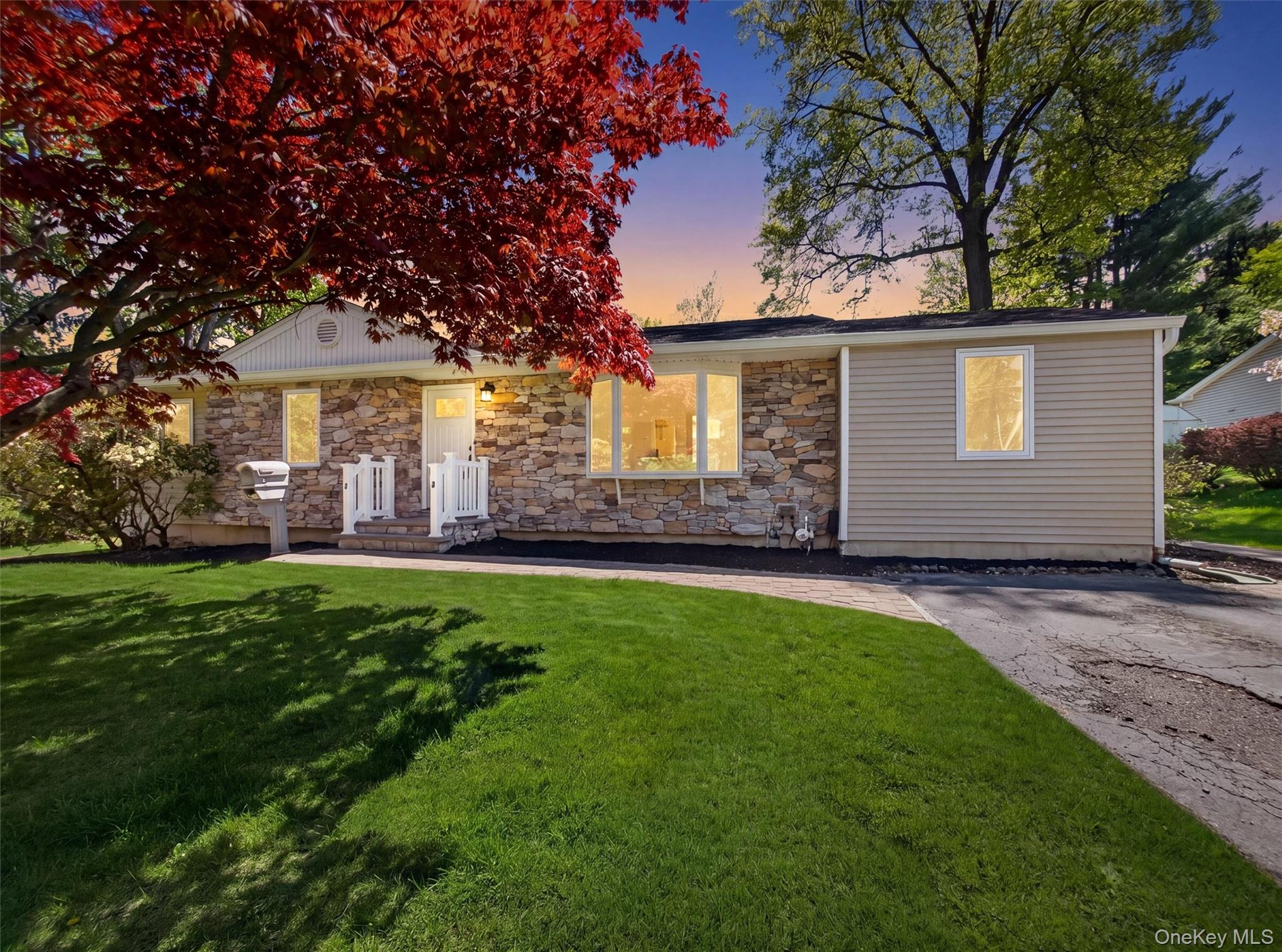 19 Buckingham Road Nanuet, NY 10954 - Photo 2 of 39 Twilight photo and extended driveway with a spacious yard.