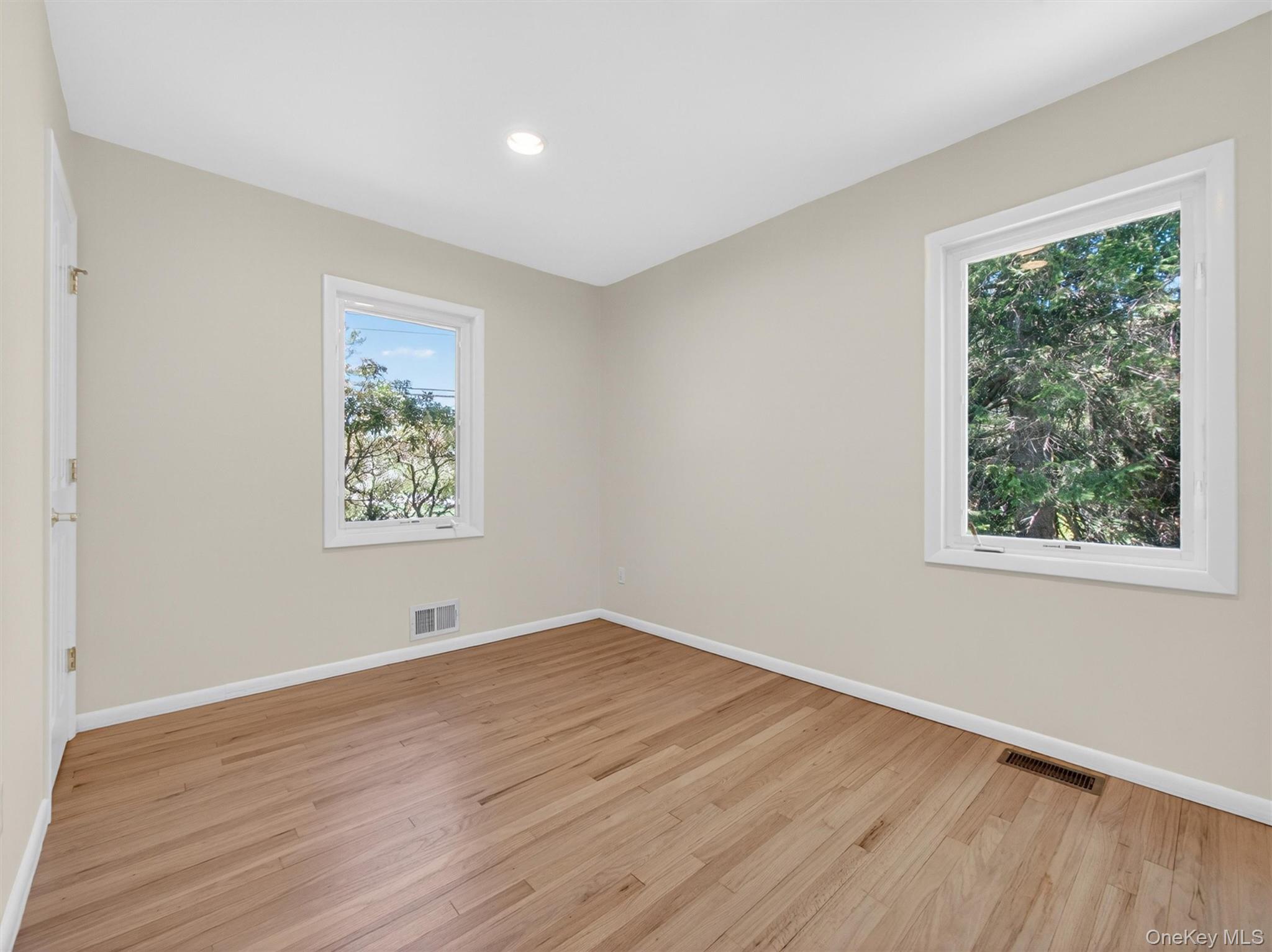 19 Buckingham Road Nanuet, NY 10954 - Photo 21 of 39 Bedroom 2: Spacious and airy bedroom featuring hardwood floors and great natural light.