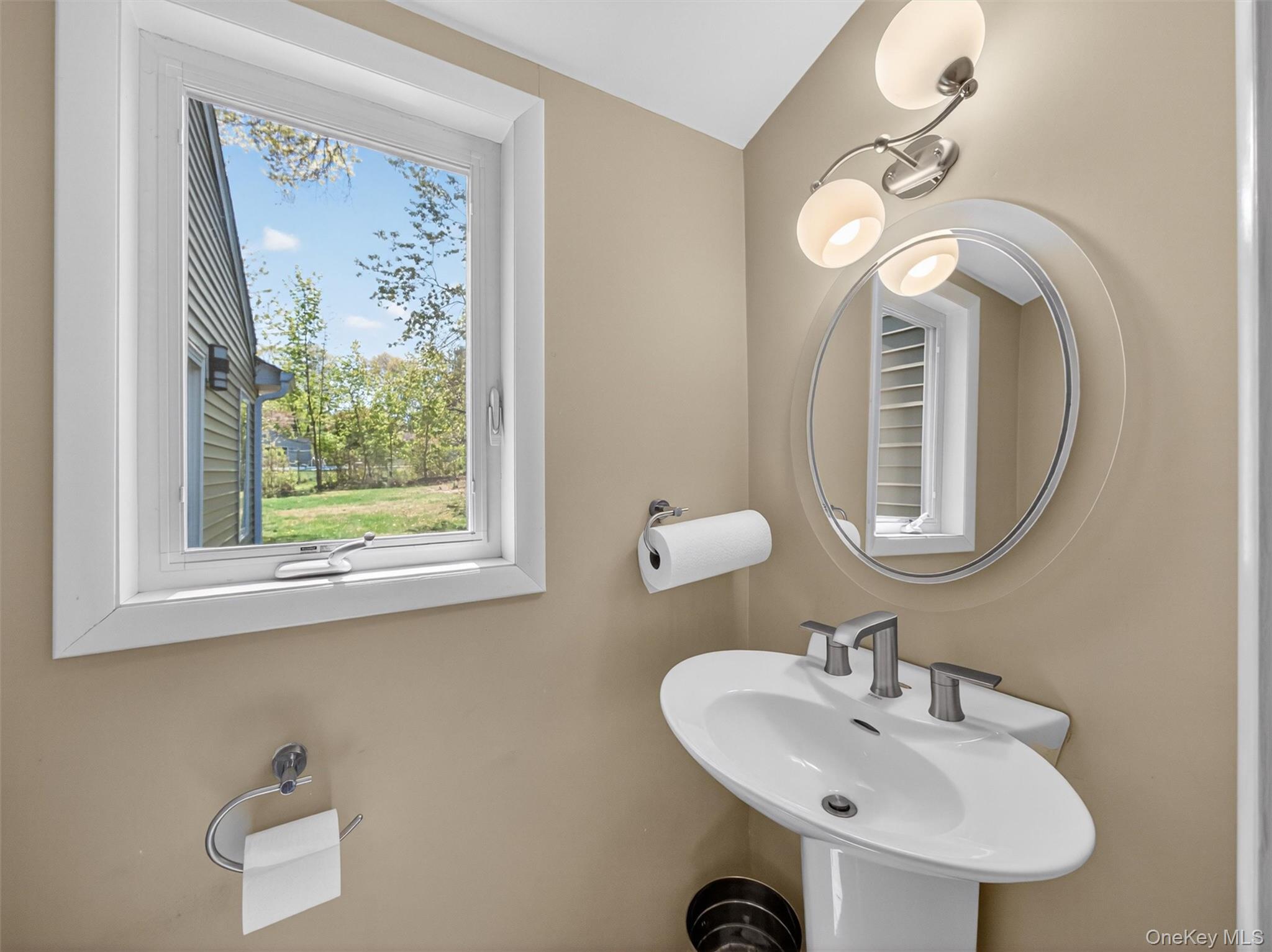 19 Buckingham Road Nanuet, NY 10954 - Photo 26 of 39 Half bathroom: Convenient private half bath located within the additional room, offering functionality and flexibility for guests or workspace use.
