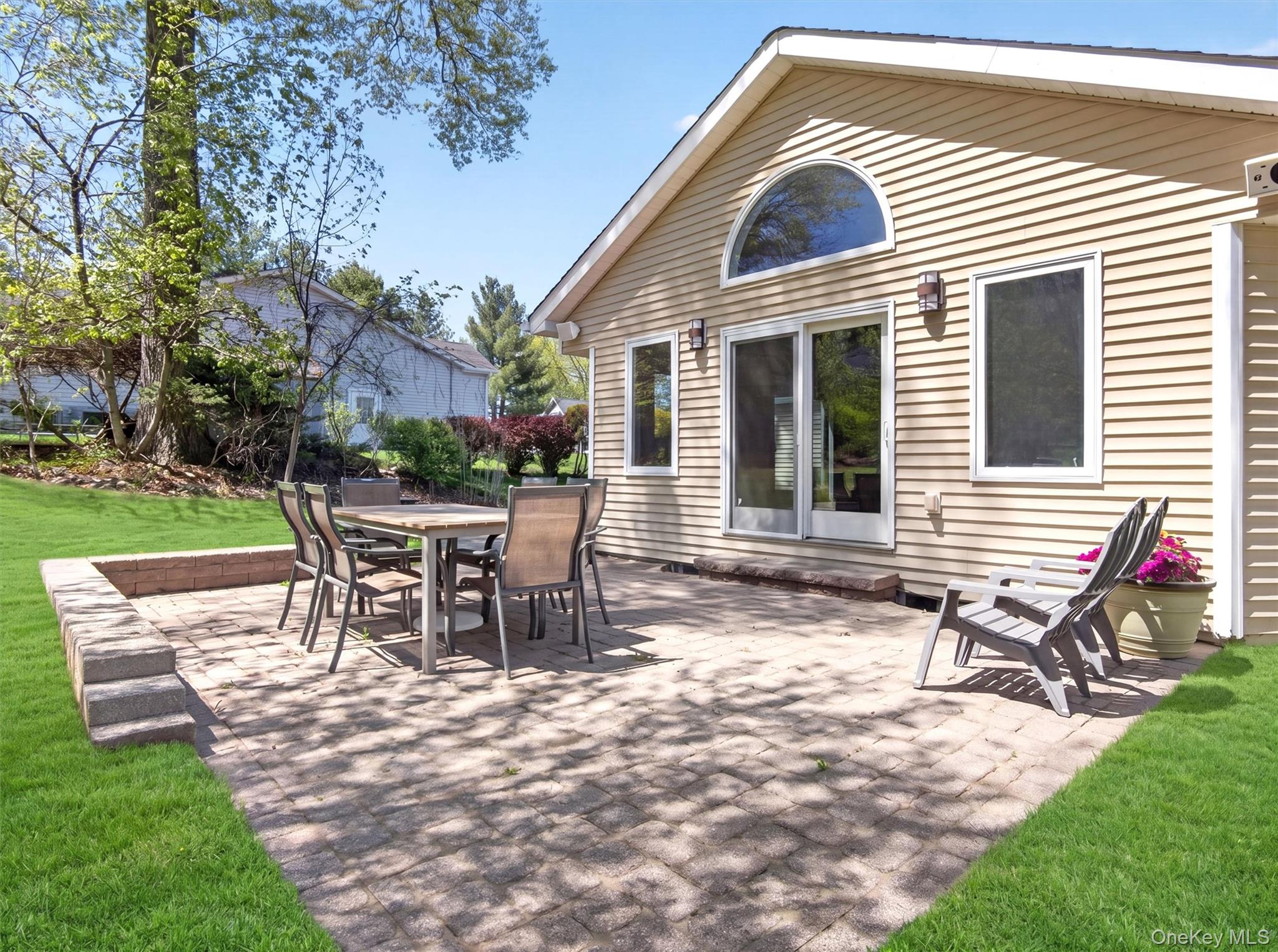 19 Buckingham Road Nanuet, NY 10954 - Photo 33 of 39 Spacious backyard with a large patio area, ideal for outdoor gatherings and everyday enjoyment.