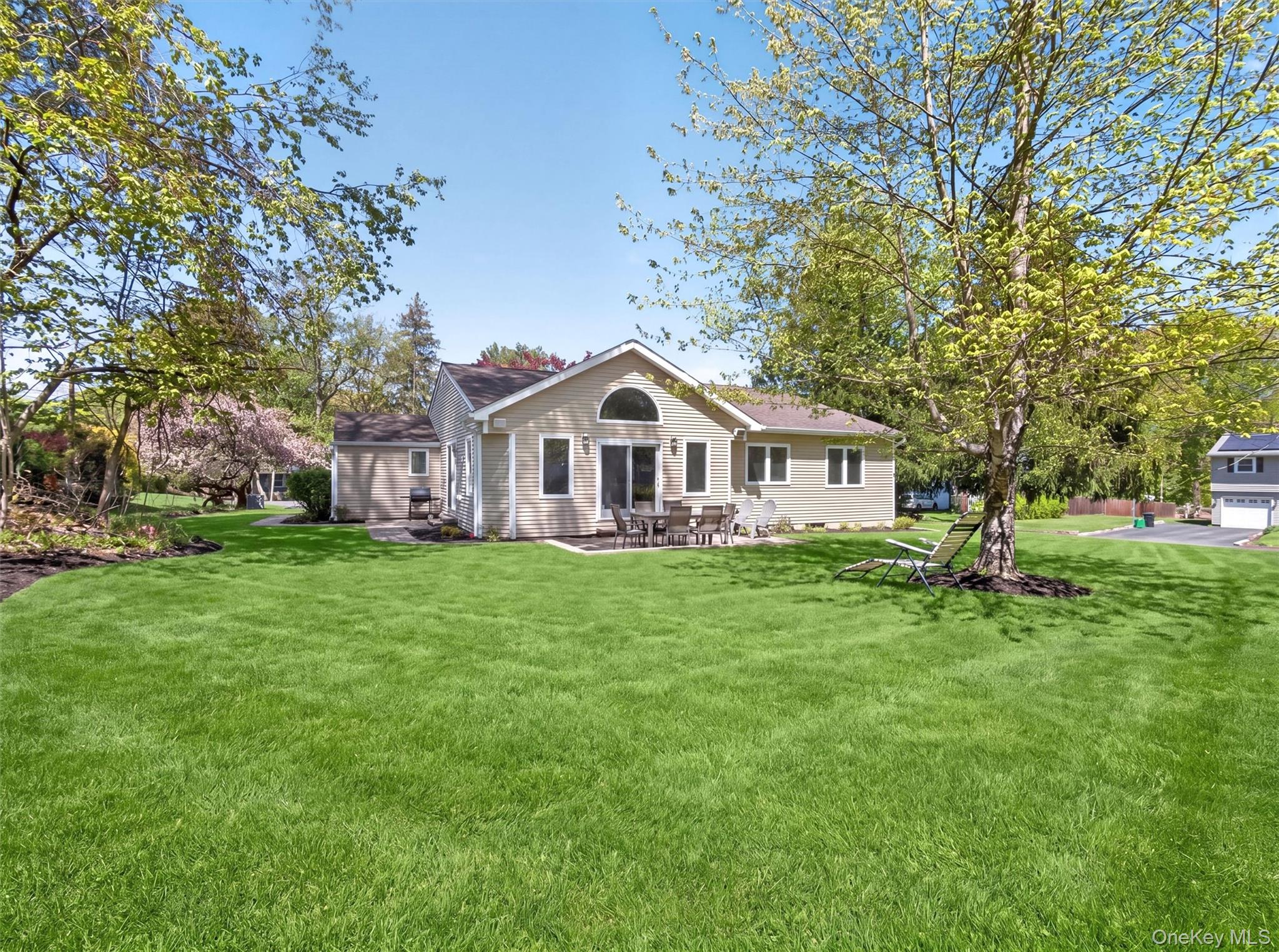 19 Buckingham Road Nanuet, NY 10954 - Photo 35 of 39 Beautifully landscaped and expansive backyard offering a spacious, well-maintained setting perfect for outdoor enjoyment and entertaining.
