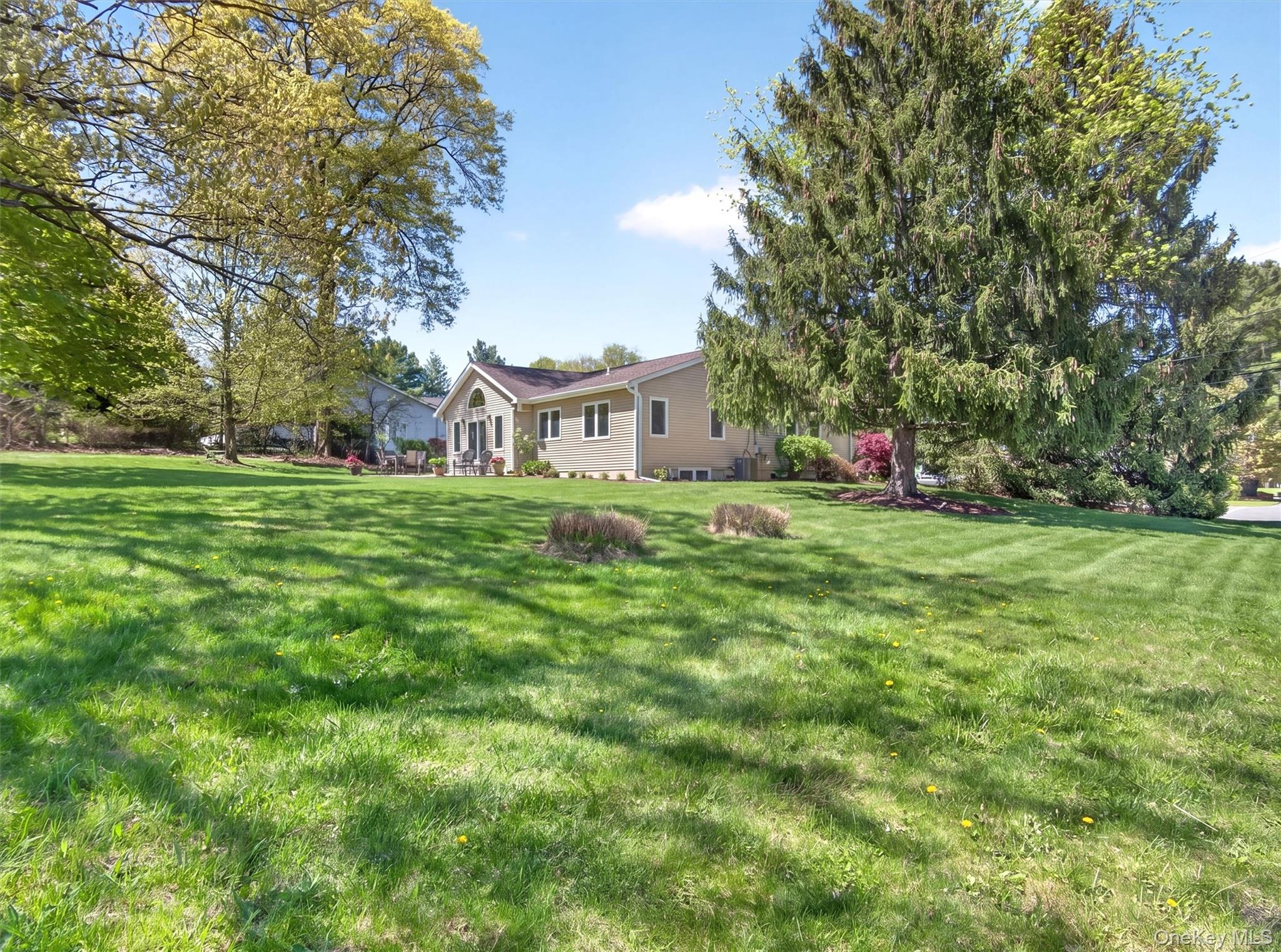 19 Buckingham Road Nanuet, NY 10954 - Photo 36 of 39 Sprawling outdoor space with lush landscaping, offering a private and inviting setting with plenty of room to relax or entertain.