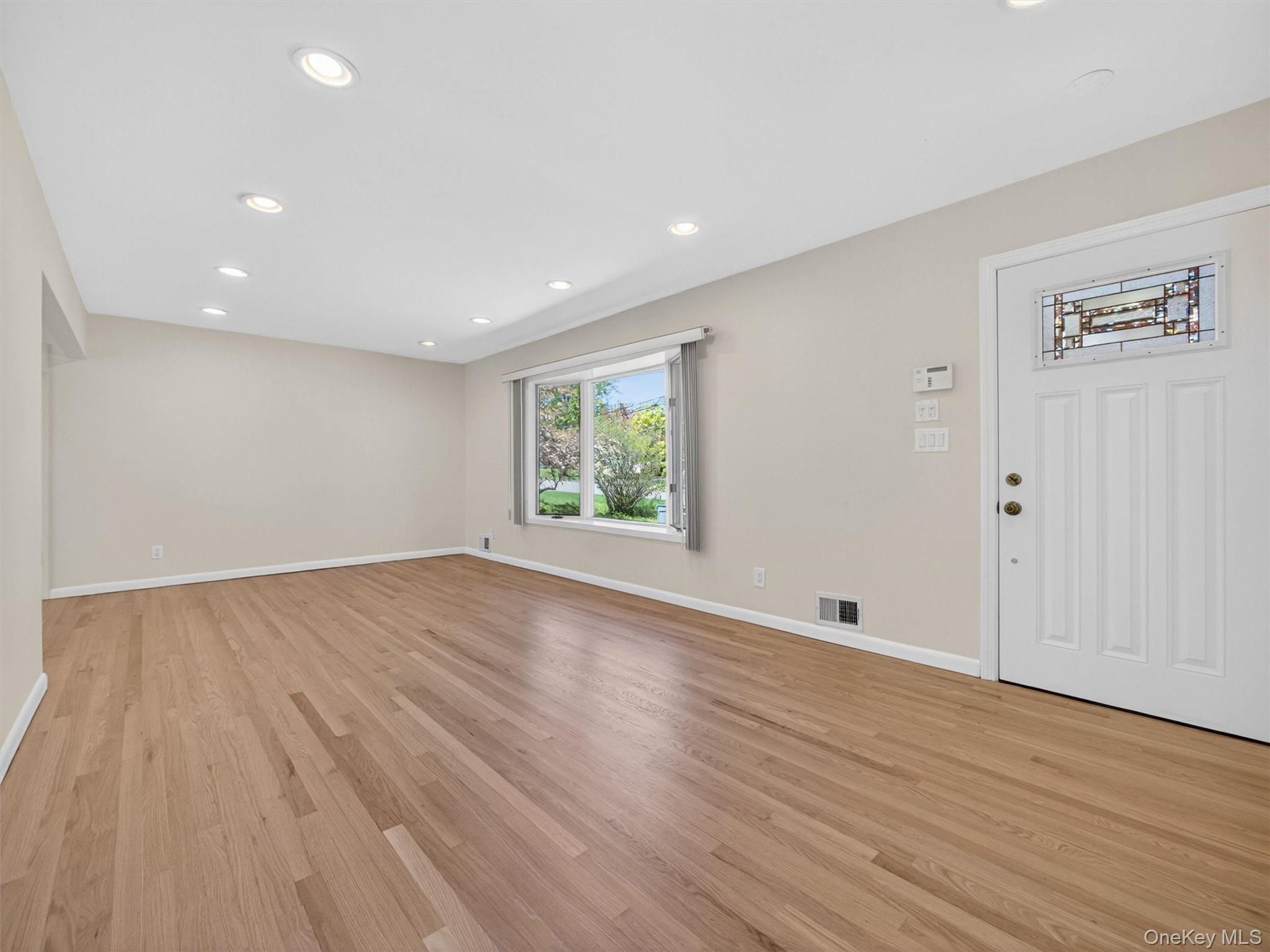 19 Buckingham Road Nanuet, NY 10954 - Photo 4 of 39 Bright and welcoming entry with hardwood floors, recessed lighting, and a clean, open feel.