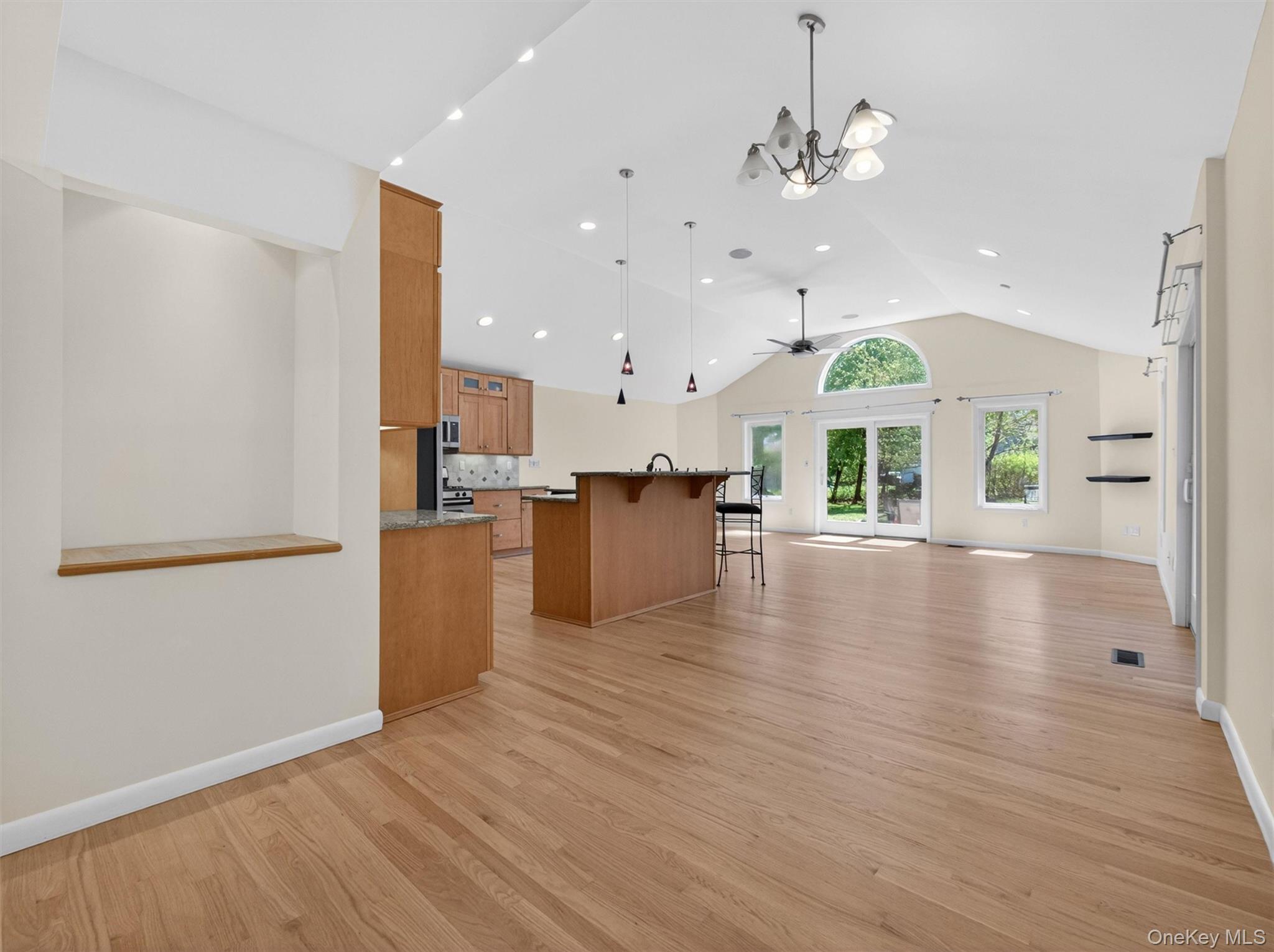 19 Buckingham Road Nanuet, NY 10954 - Photo 7 of 39 Bright dining area with an open-concept design, seamlessly connecting to the kitchen and living spaces, enhanced by high ceilings and abundant natural light.