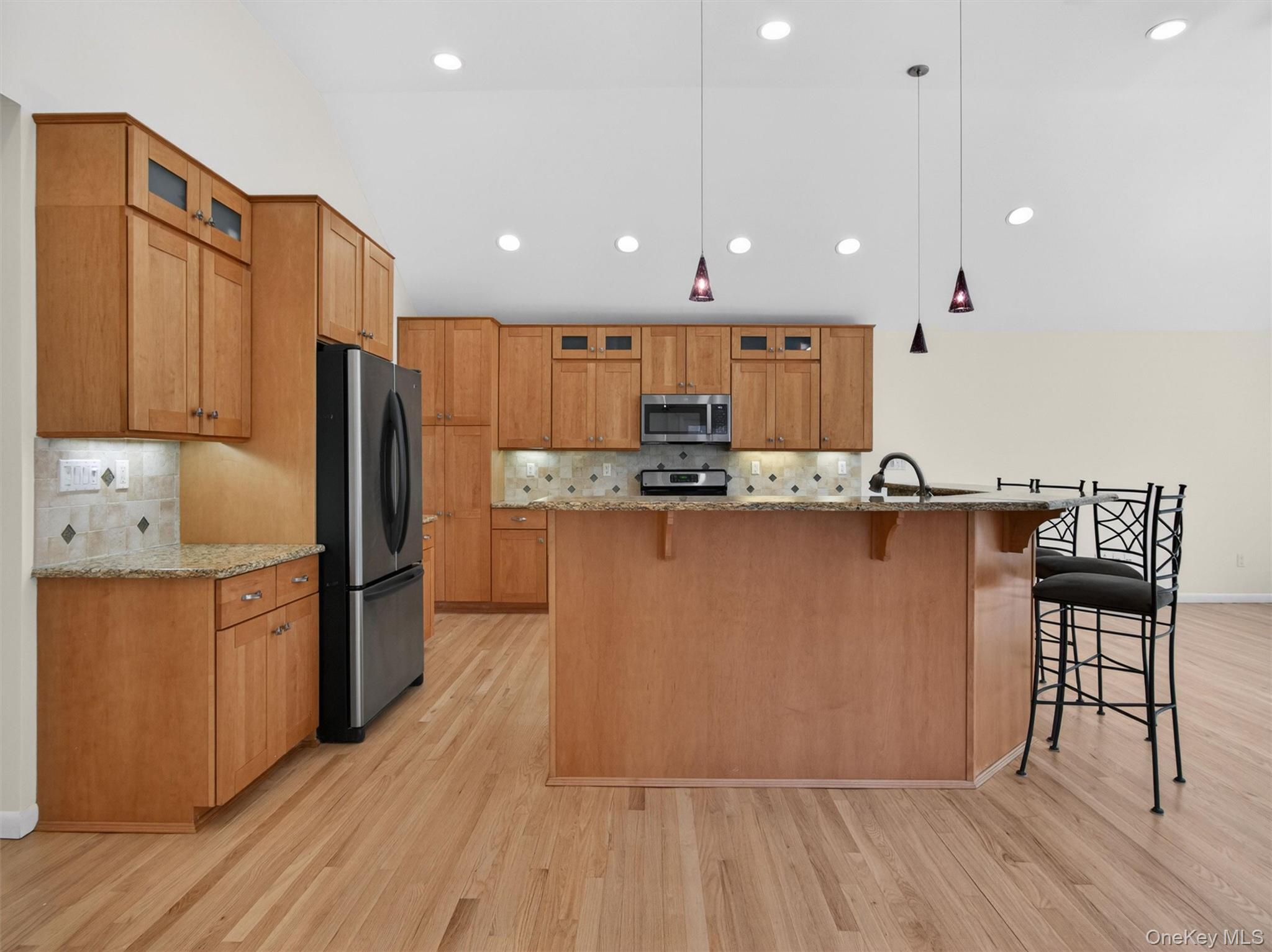 19 Buckingham Road Nanuet, NY 10954 - Photo 10 of 39 Spacious kitchen with center island seating, open layout, and vaulted ceilings, perfect for everyday living and entertaining.