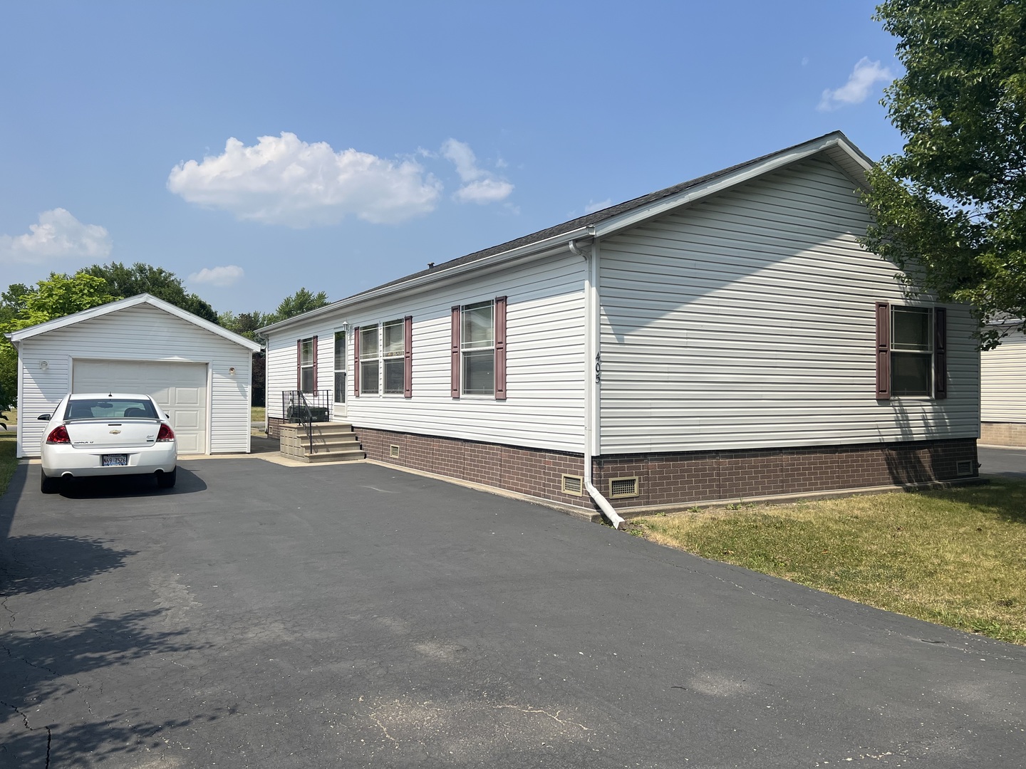 405 James Road Elwood, IL 60421 - Photo 1 of 27 a house view with a backyard space