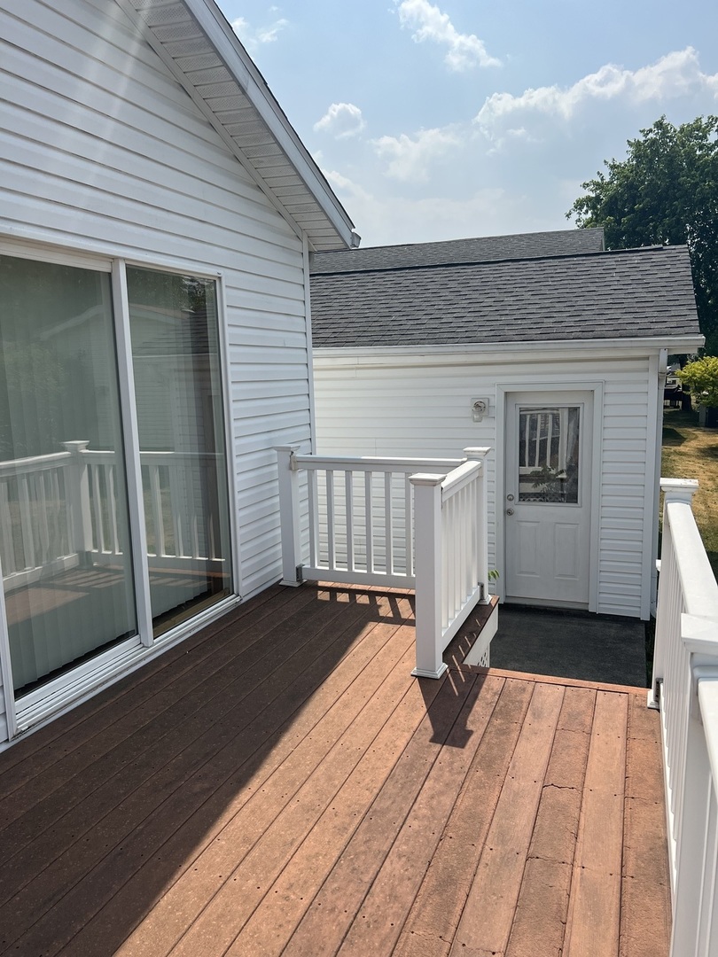 405 James Road Elwood, IL 60421 - Photo 21 of 27 a view of a balcony with wooden floor