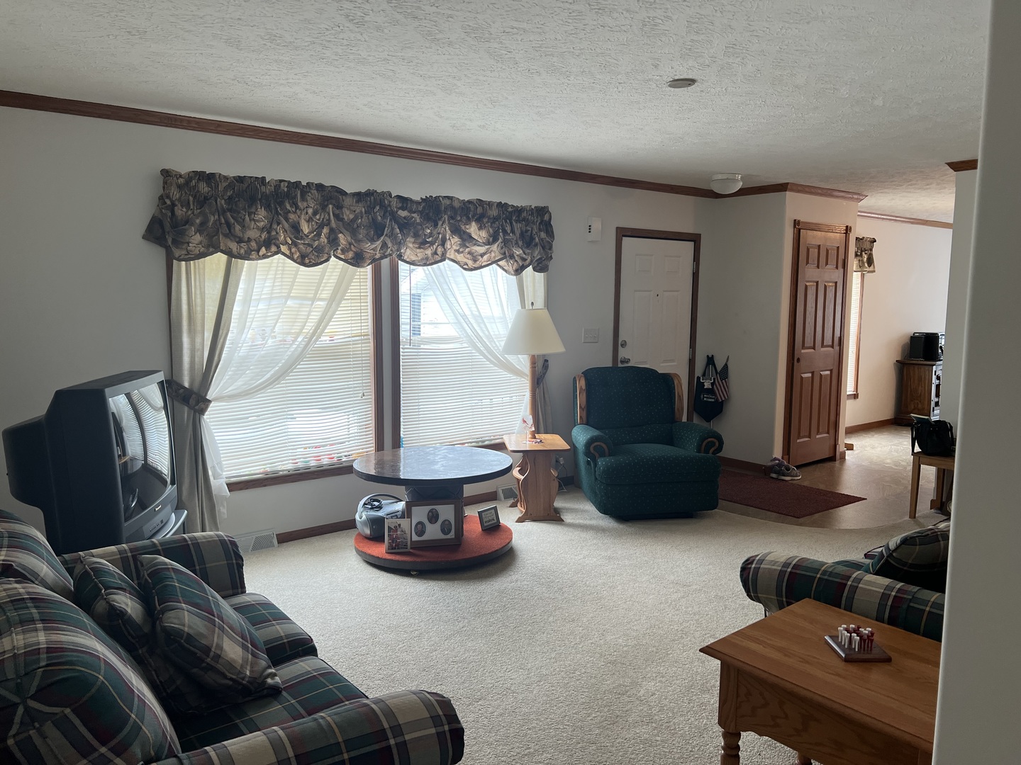 405 James Road Elwood, IL 60421 - Photo 4 of 27 a living room with furniture and a large window