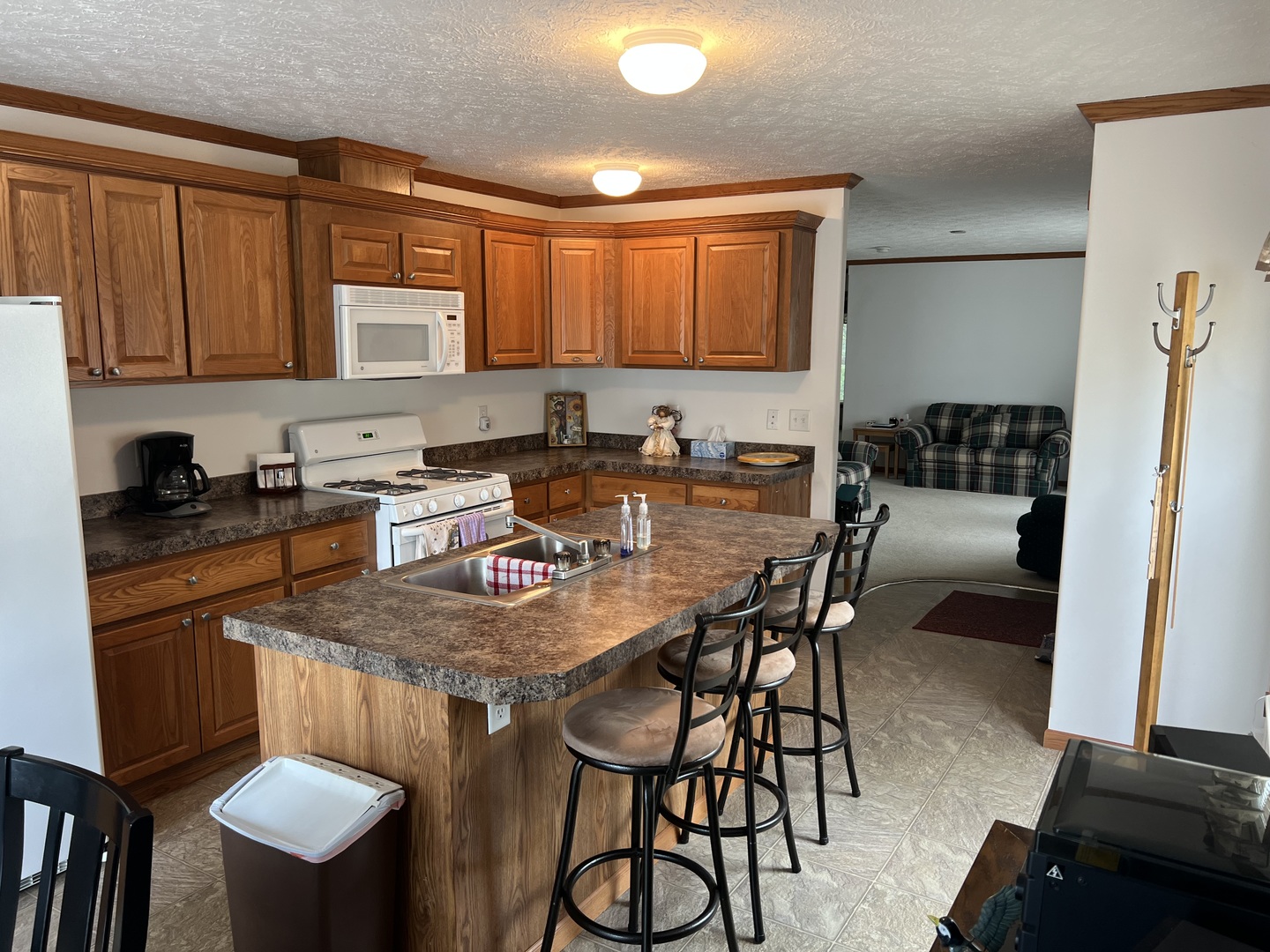 405 James Road Elwood, IL 60421 - Photo 6 of 27 a kitchen with a dining table chairs and refrigerator