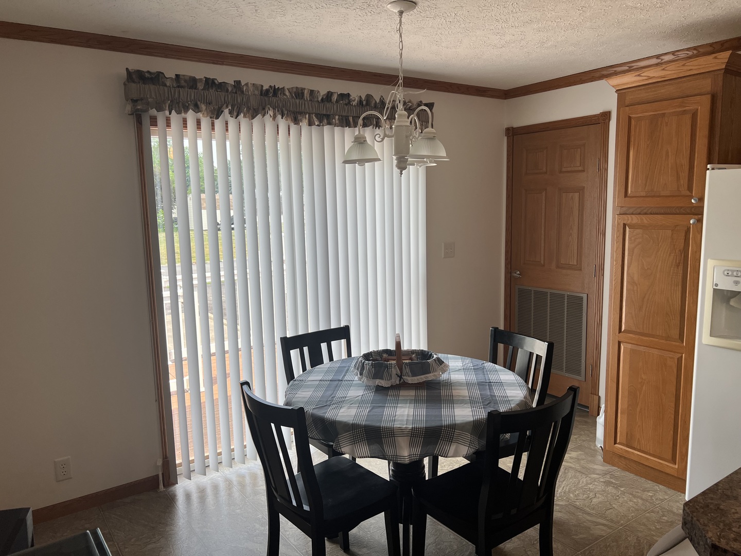 405 James Road Elwood, IL 60421 - Photo 7 of 27 a view of a dining room with furniture window and wooden floor