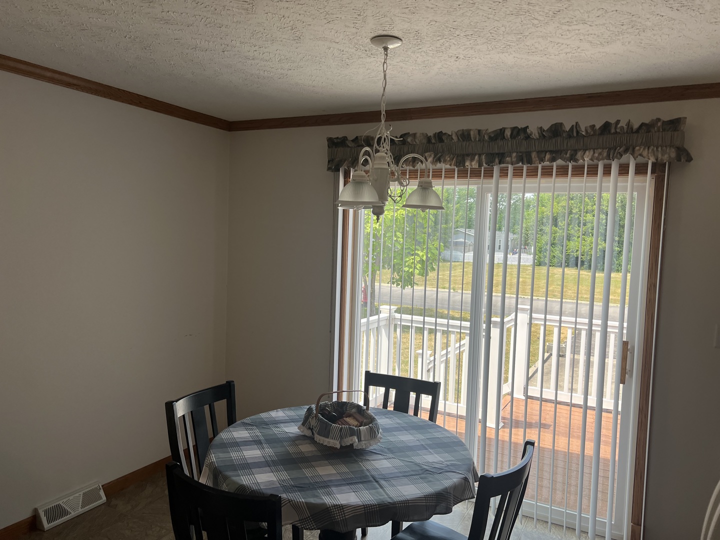 405 James Road Elwood, IL 60421 - Photo 8 of 27 a view of a room that has a table and chairs in it