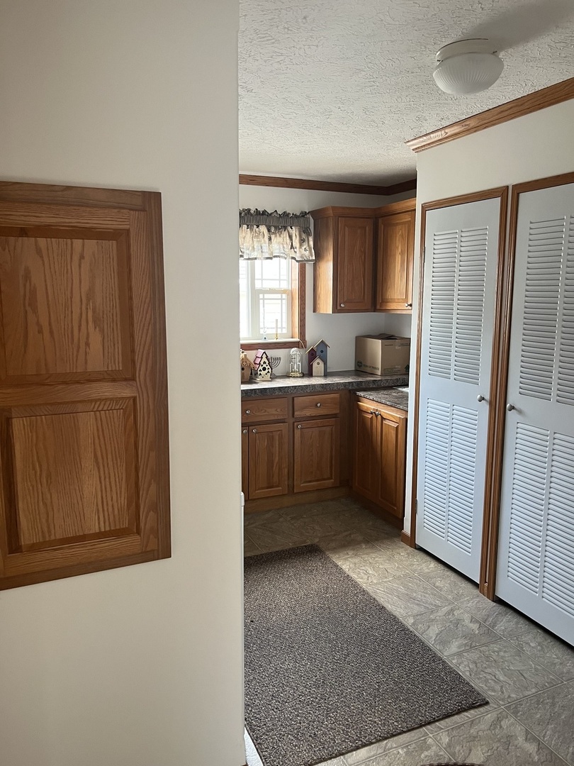 405 James Road Elwood, IL 60421 - Photo 10 of 27 a kitchen with stainless steel appliances granite countertop a refrigerator sink and cabinets