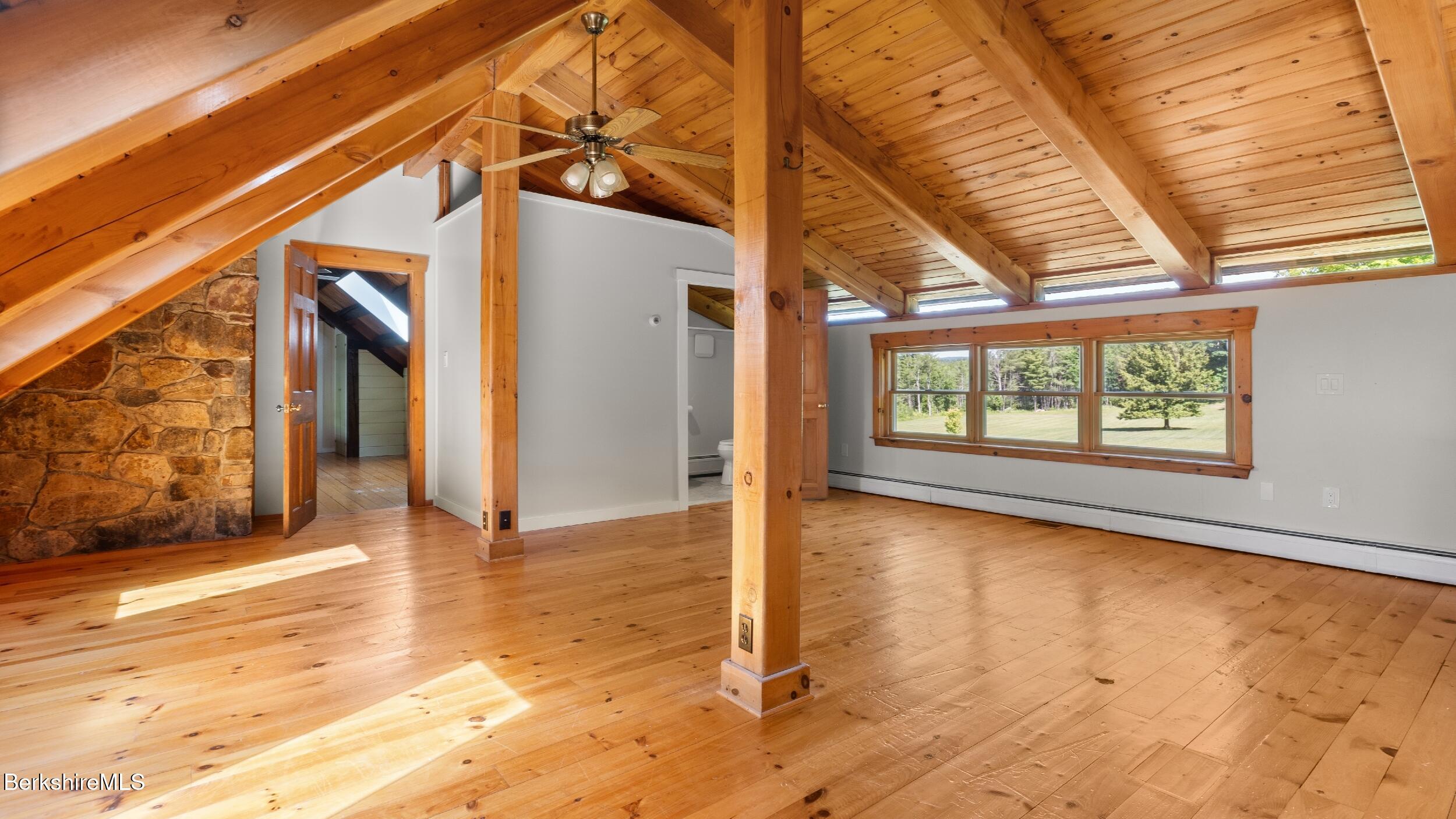 134 Hurlburt Road Great Barrington, MA 01230 - Photo 34 of 50 a view of an empty room with wooden floor and a window