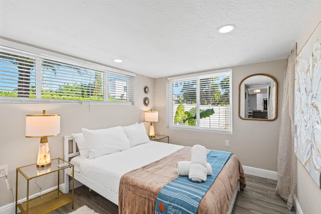 a bathroom with a sink vanity and shower