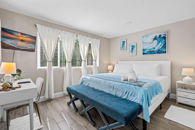 a bathroom with a sink toilet and a mirror