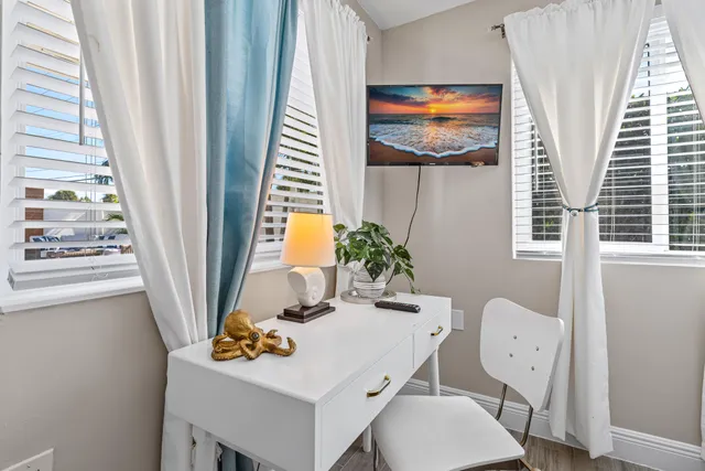 a view of a house with swimming pool and sitting area