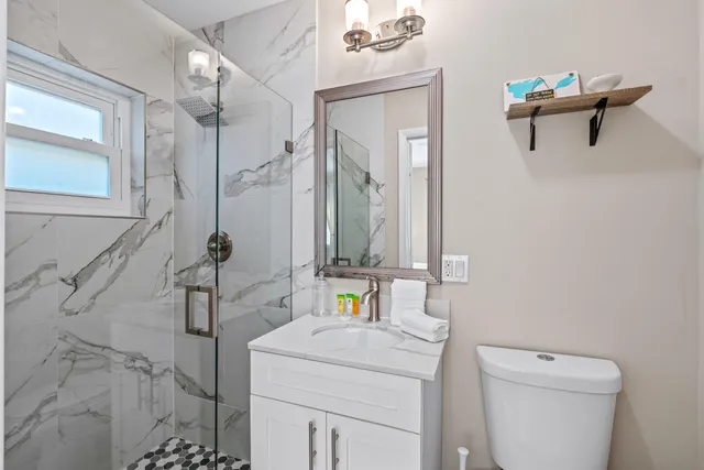 a front view of house with yard seating and green space